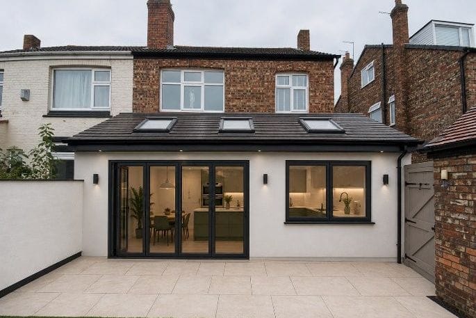 Design visualisation of a rendered mono-pitched rear extension with bi-fold doors and rooflights