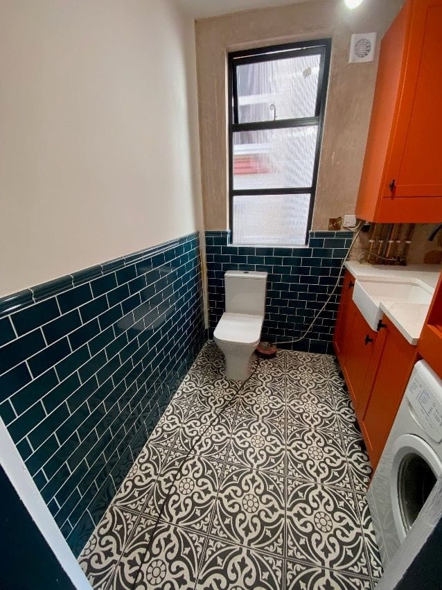 The combined WC, utility and storage space during the fit-out