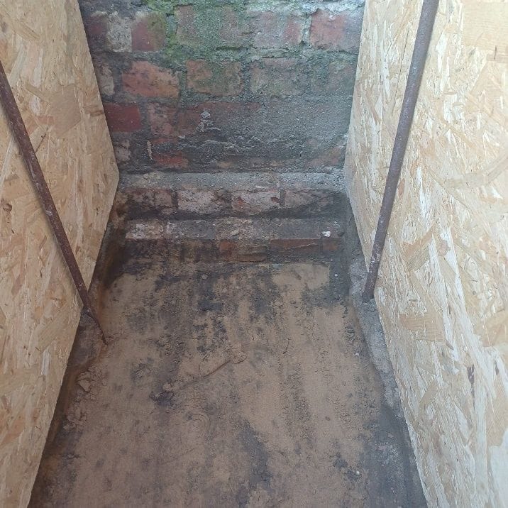 The original house footings beside the depth of the new foundations