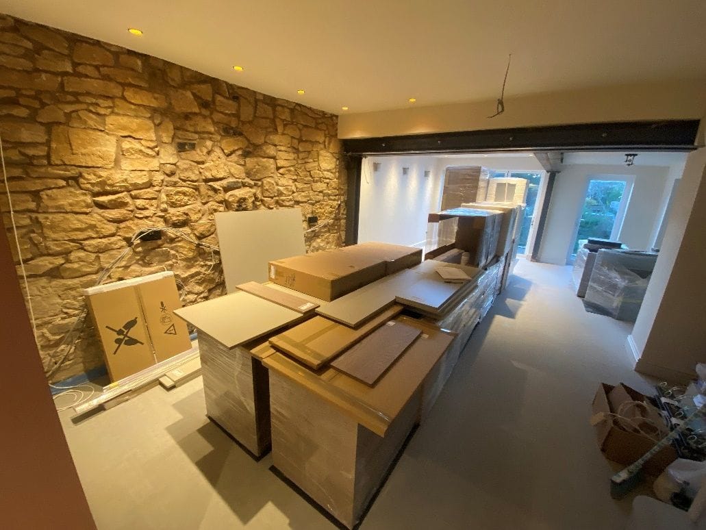 The finished open-plan kitchen with exposed steelwork